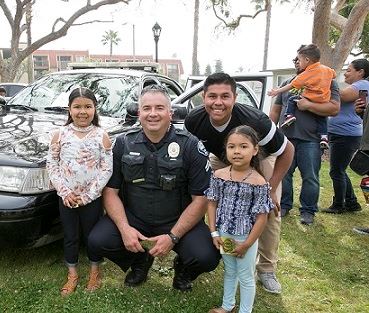 Officer with Kids and Police Car at Spring Fest 