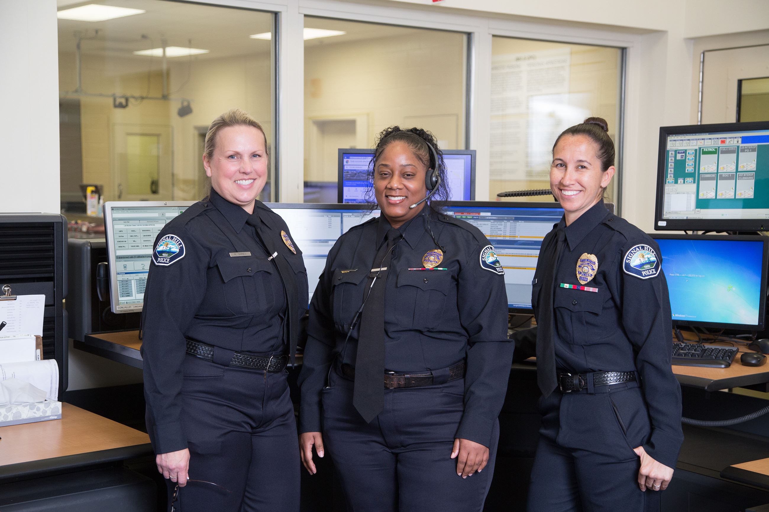 Dispatchers in front of dispatch desk