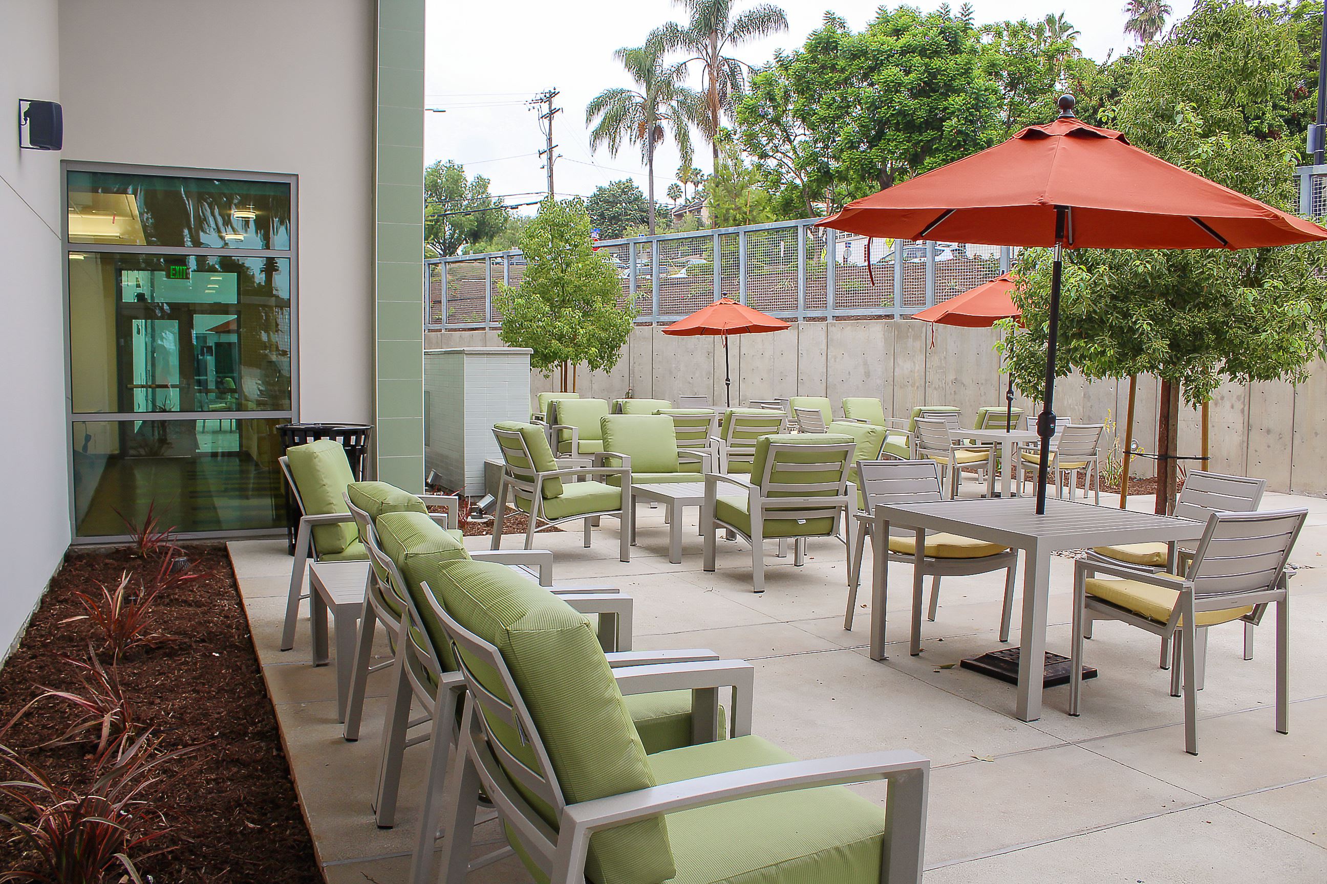 Exterior Courtyard with tables, chairs and umbrellas